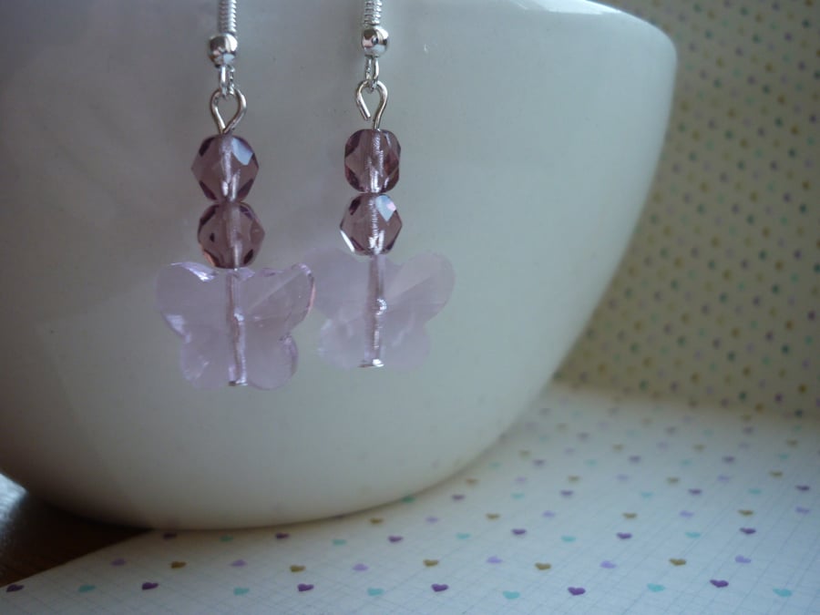 SHADES OF PINK AND SILVER FACETED GLASS BUTTERFLY EARRINGS.