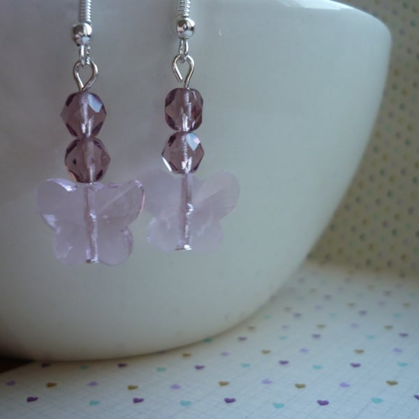 SHADES OF PINK AND SILVER FACETED GLASS BUTTERFLY EARRINGS.