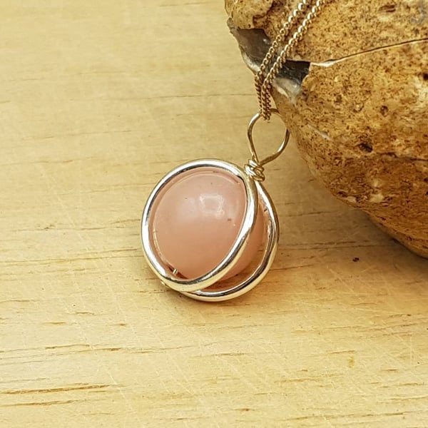 Minimalist pink Opal circle pendant. Sterling silver. October birthstone