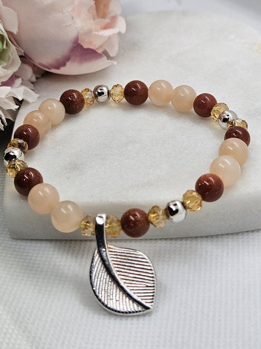 Goldstone and aventurine silver leaf charm stretch bracelet