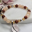 Goldstone and aventurine silver leaf charm stretch bracelet