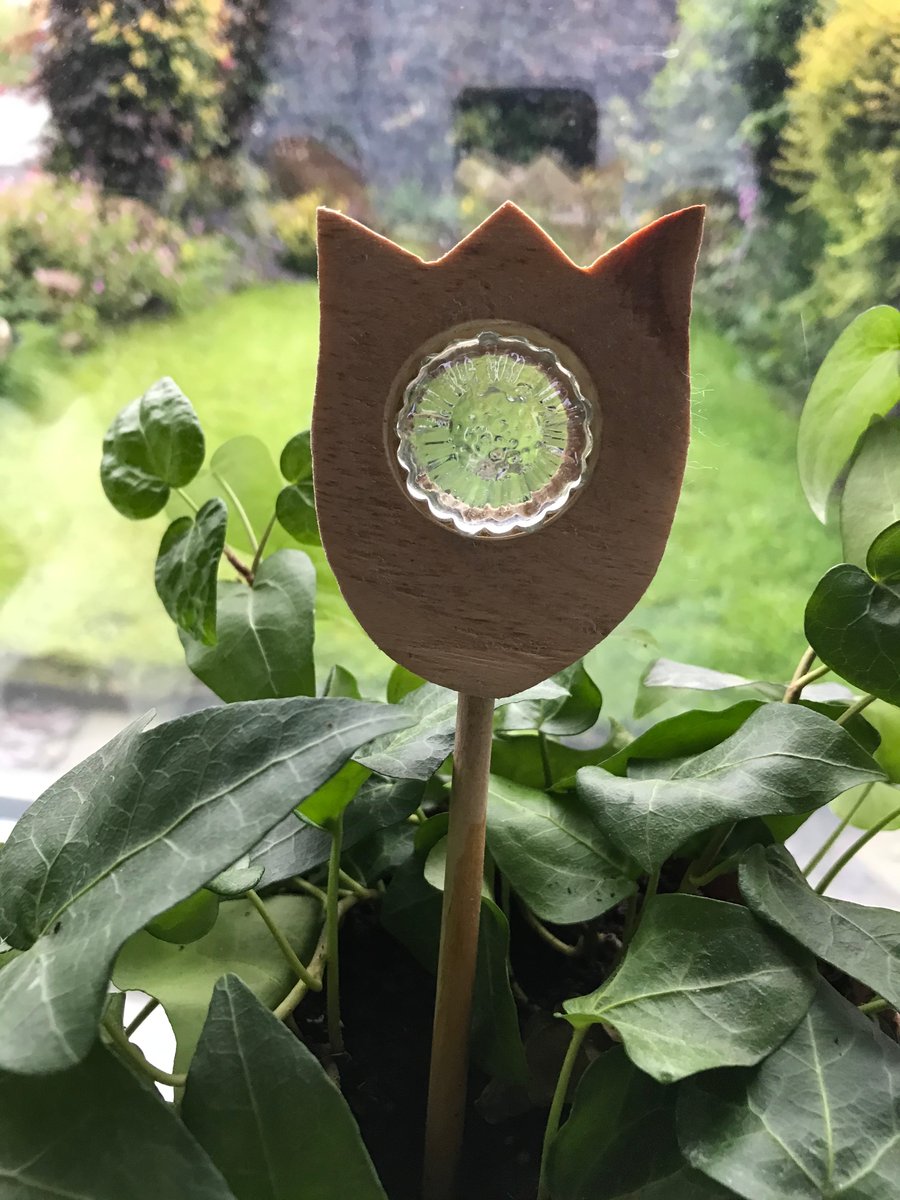 Hand cut Wooden Tulip with a clear glass sunflower pebble and wooden stick stem
