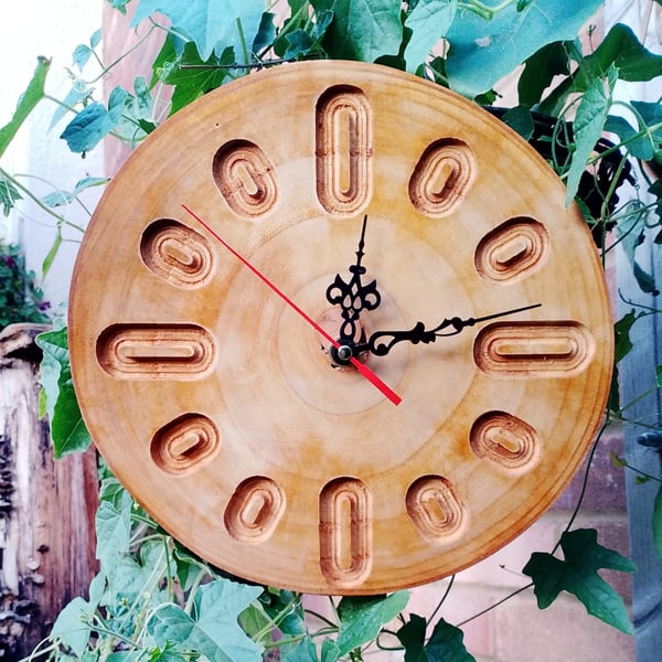 Handcrafted pine wall clock with quartz movement.