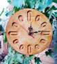 Handcrafted pine wall clock with quartz movement.