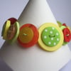 Citrus-Yellow, Orange, Green button bracelet 