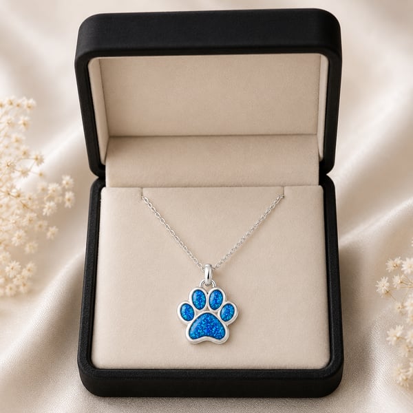 In loving memory paw pendant laid  with ashes 
