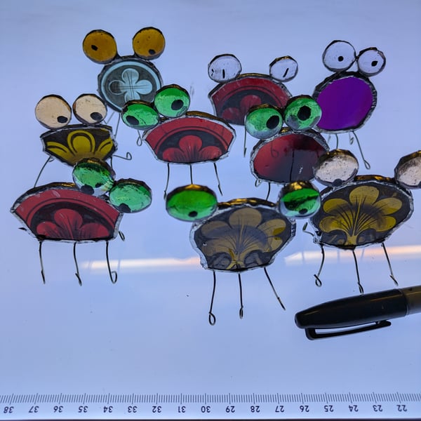 Infestive painted stained glass Bugs with round and square bodies