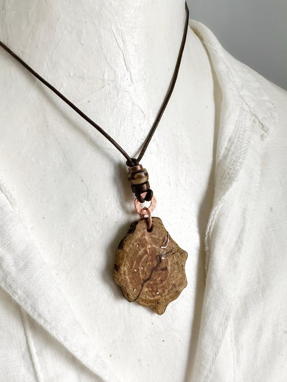 Carved Cherry Wood Pendant Inlaid With Copper On A Leather Cord