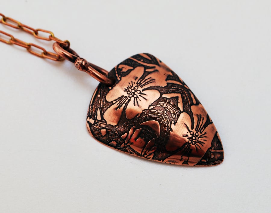 Etched Floral copper triangle pendant, oxidised and domed
