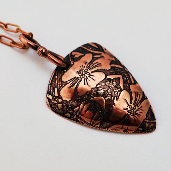 Etched Floral copper triangle pendant, oxidised and domed