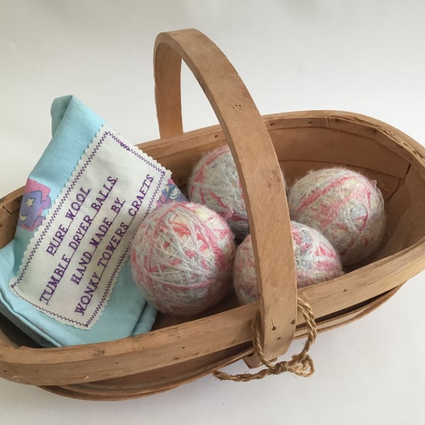 Four wool tumble dryer balls - pastel colours. Energy saving and plastic free.