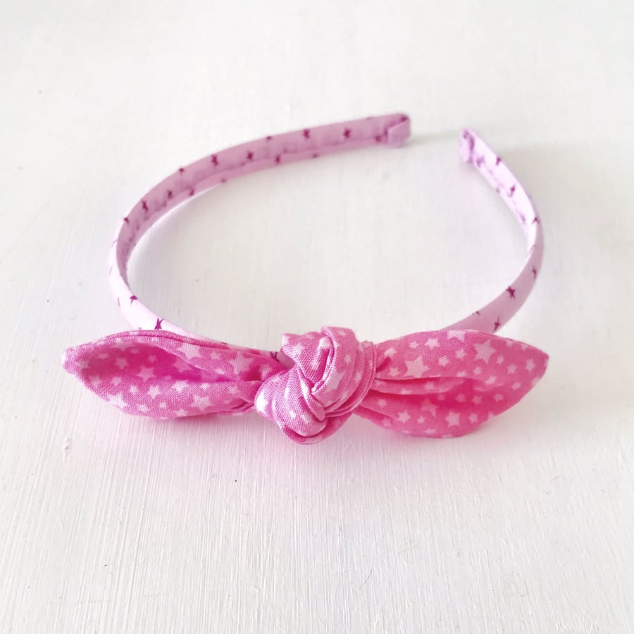 Alice Band in Pink Star With Bow Embellishment