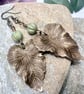 Sage green Czech glass and brass leaf pendant and earrings set, boho jewellery - Image 4