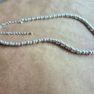 Simplicity necklace in Matte Silver.