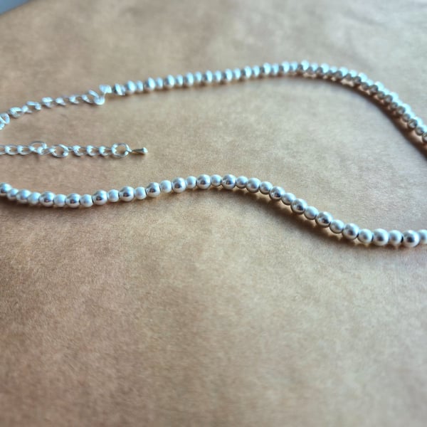 Simplicity necklace in Matte Silver.