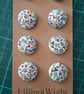 Set of eight scrap bag buttons - floral design on off white background