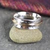 Silver and gold spinner ring.