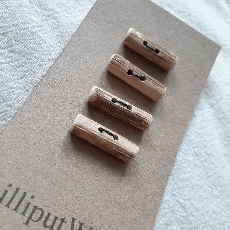 Four driftwood toggle buttons