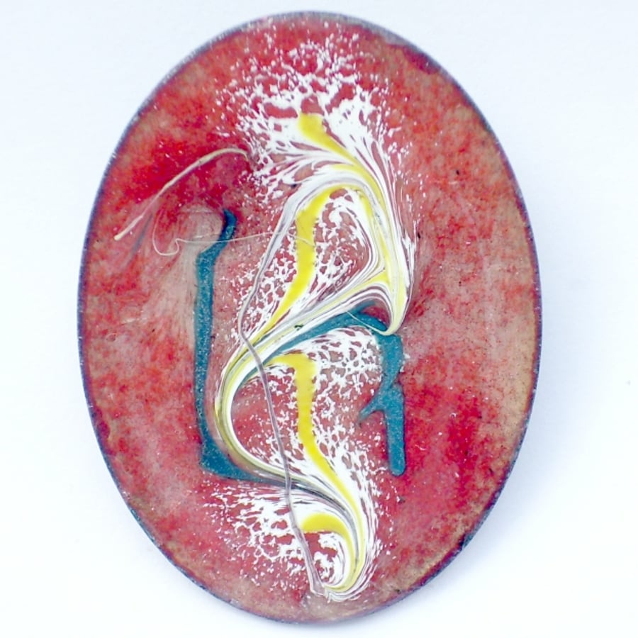 Enamel brooch - scrolled white, yellow, green over red