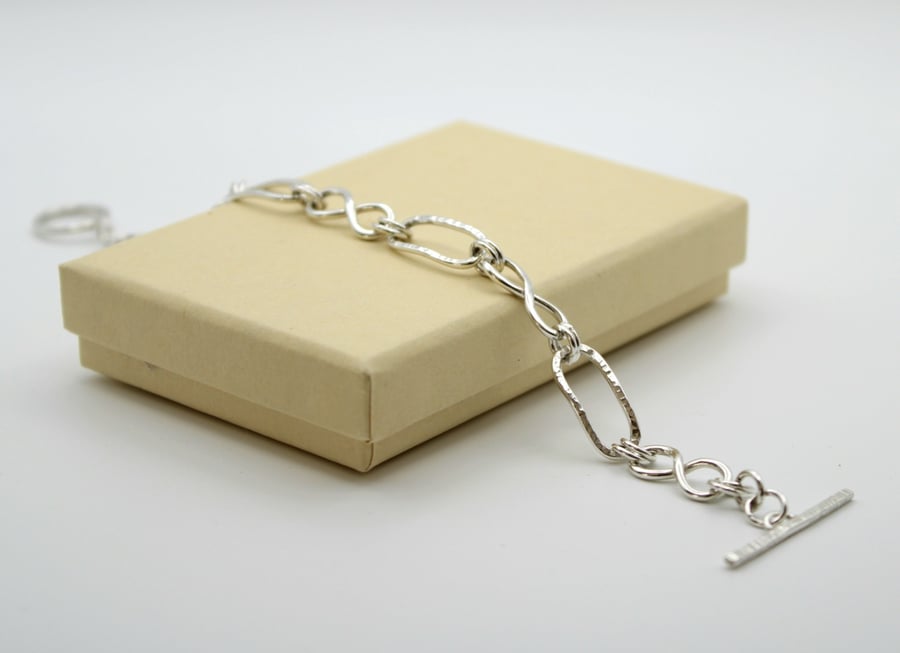 Silver link bracelet knotted and paperclip links