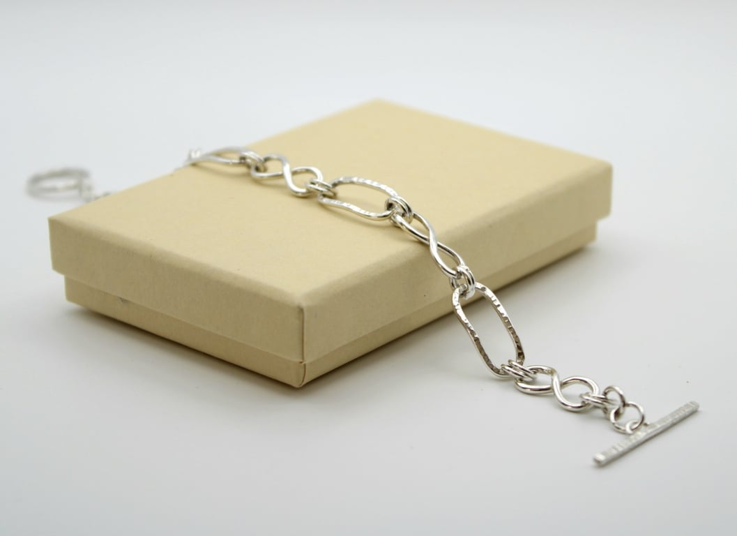 Silver link bracelet knotted and paperclip links