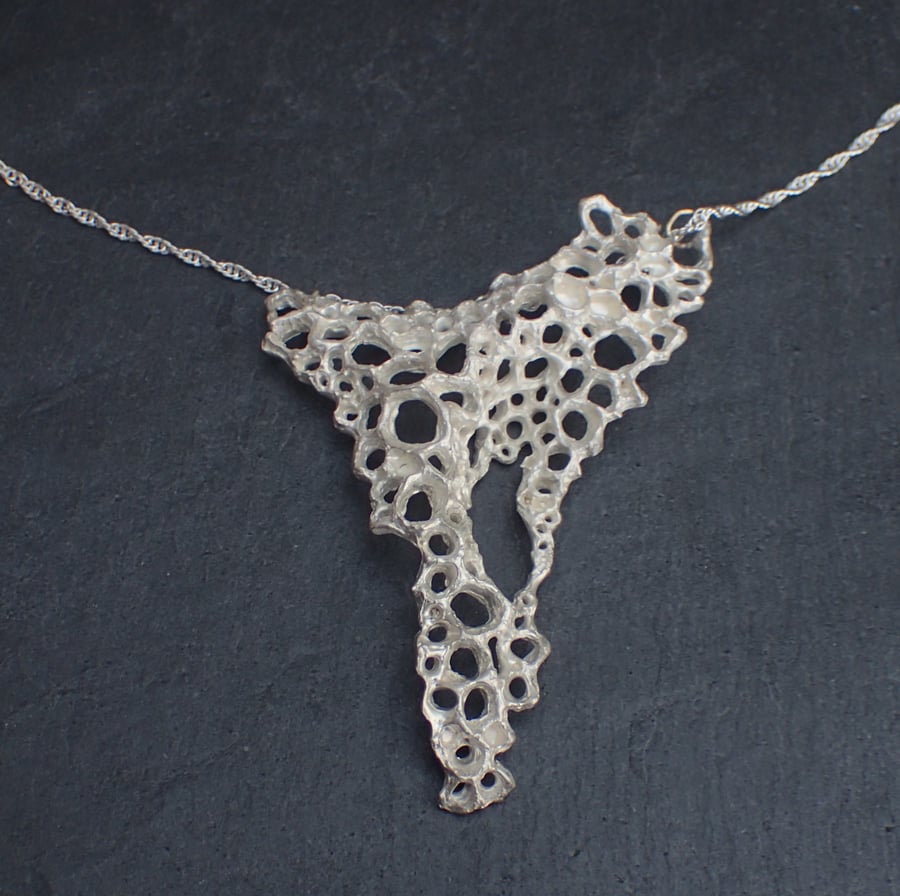 Wearable sculpture. Carved silver necklace, ethically made.