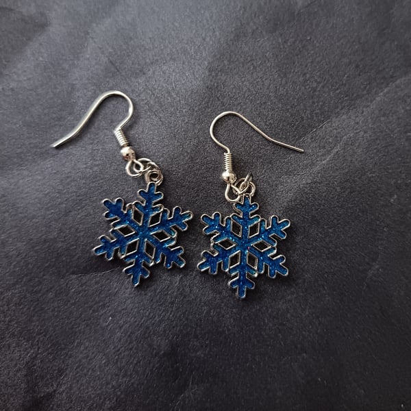 Silver and blue snowflake charm dangle earrings  