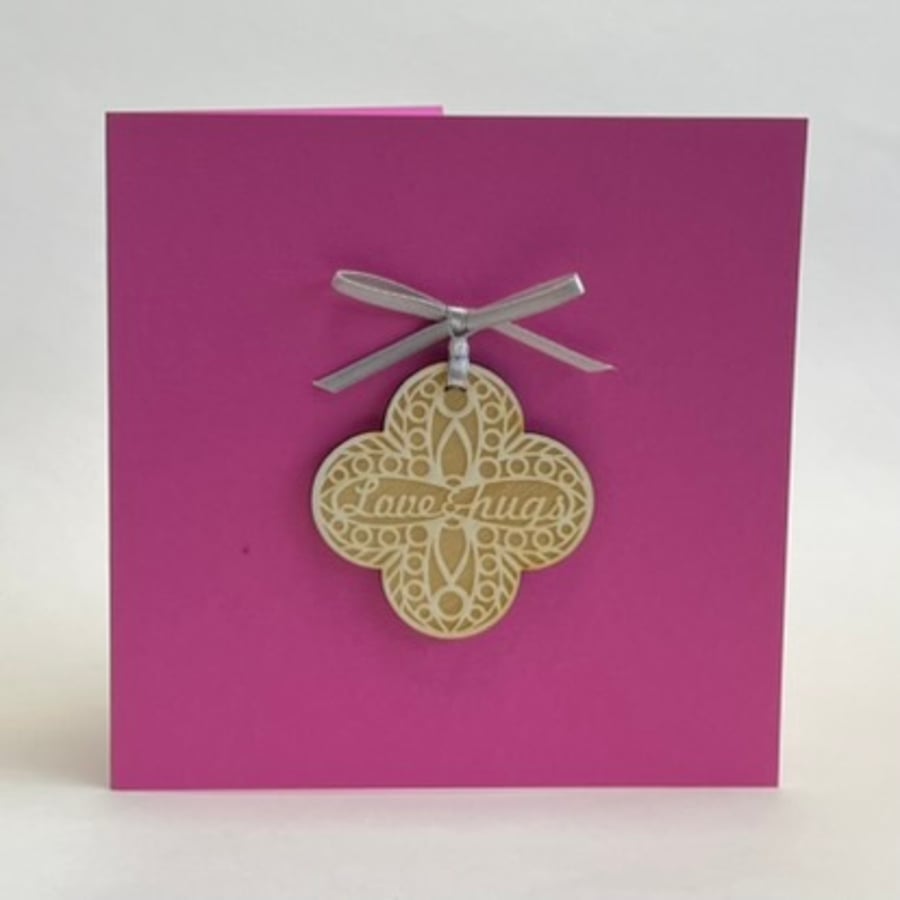 'Love & hugs' card with detachable decoration