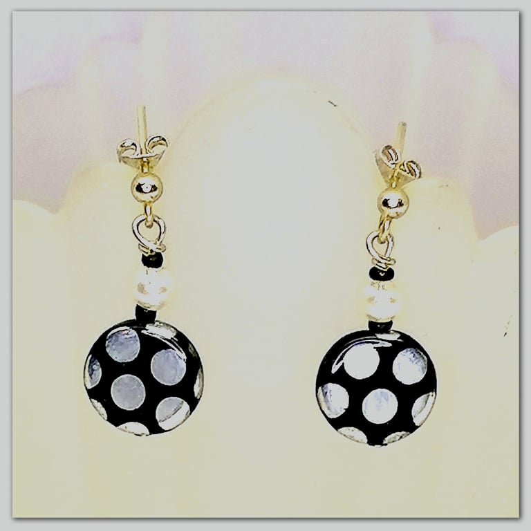  Handmade Glass bead earrings with metallic spot pattern on silver plated posts.
