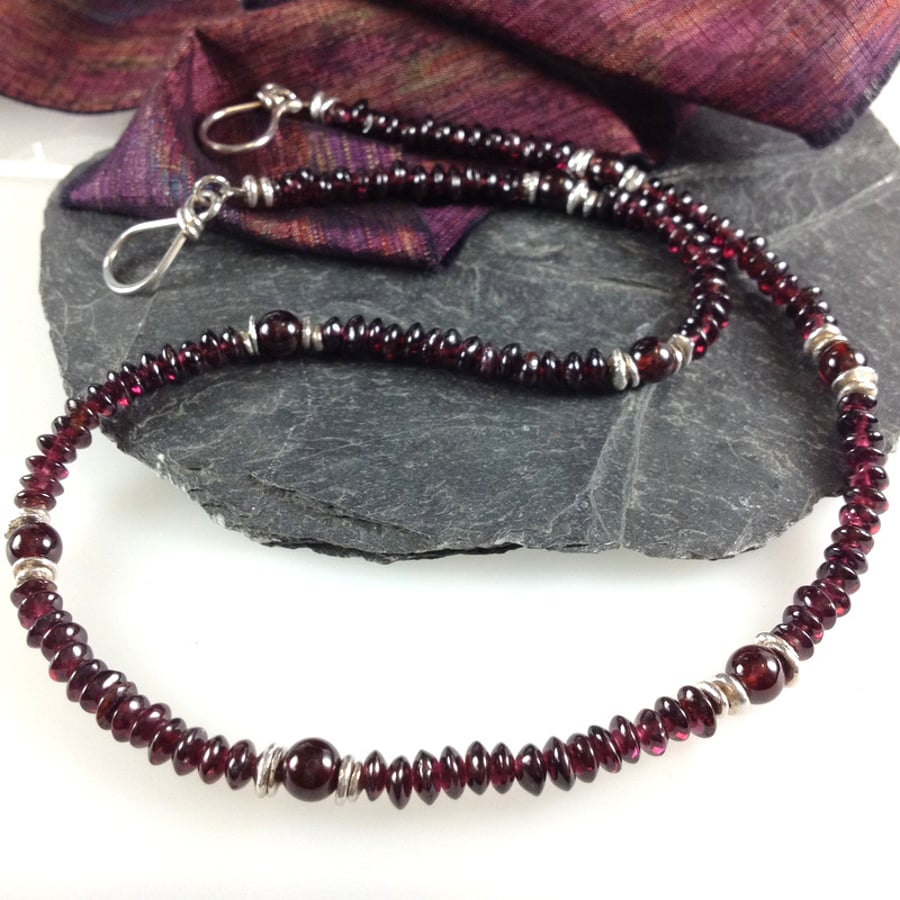 silver and garnet necklace.