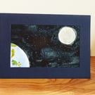 An almost familiar blue-green planet, hanging in space near a bright moon