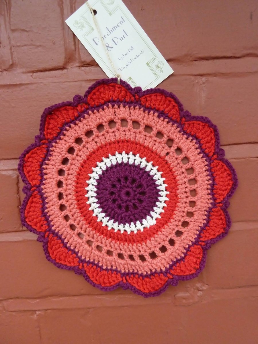 Crochet Doillie mat in rich, vibrant shades.
