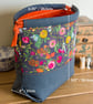Drawstring project bag made with bright floral print in grey and orange - Image 8