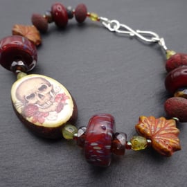 lampwork glass brown beaded bracelet, ceramic skull