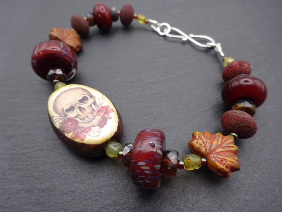 lampwork glass brown beaded bracelet, ceramic skull