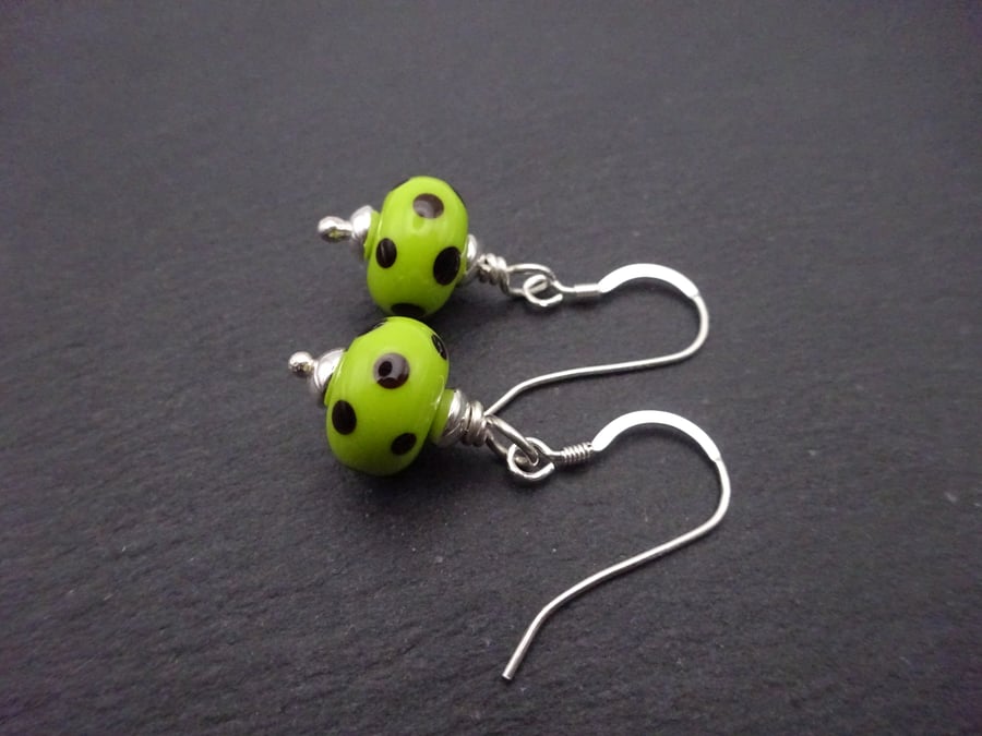 Lampwork glass earrings, lime green and black polka dot