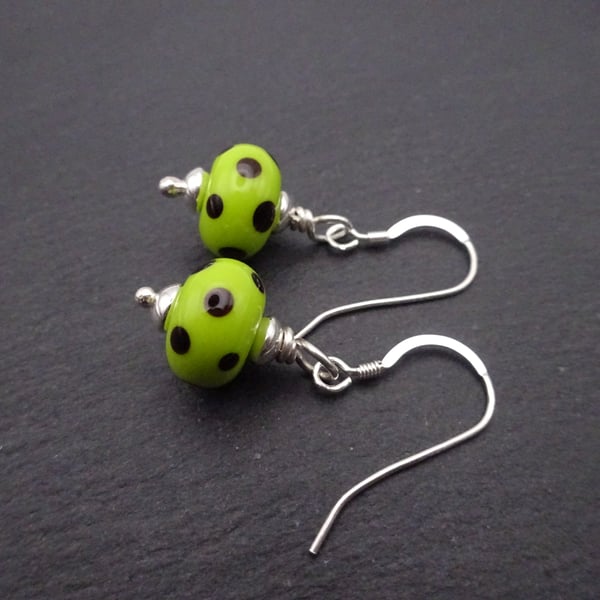 Lampwork glass earrings, lime green and black polka dot