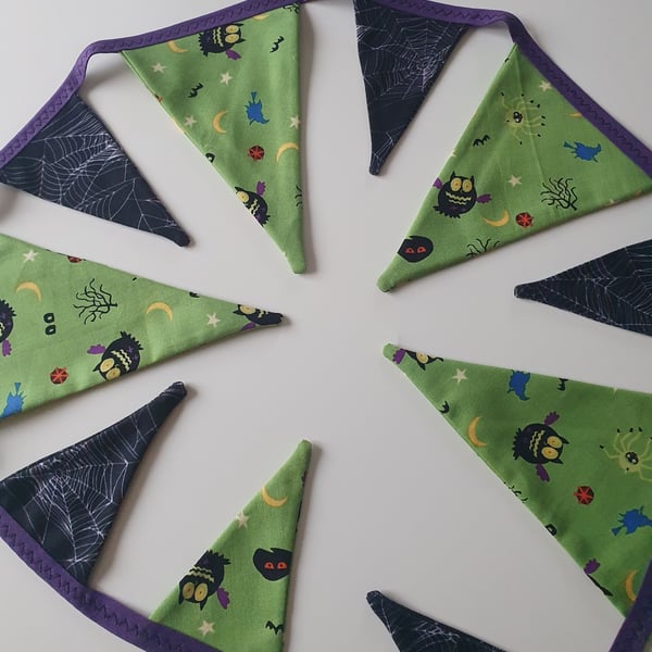 Green and Black Cobwebs and Owls Bunting on Purple Binding