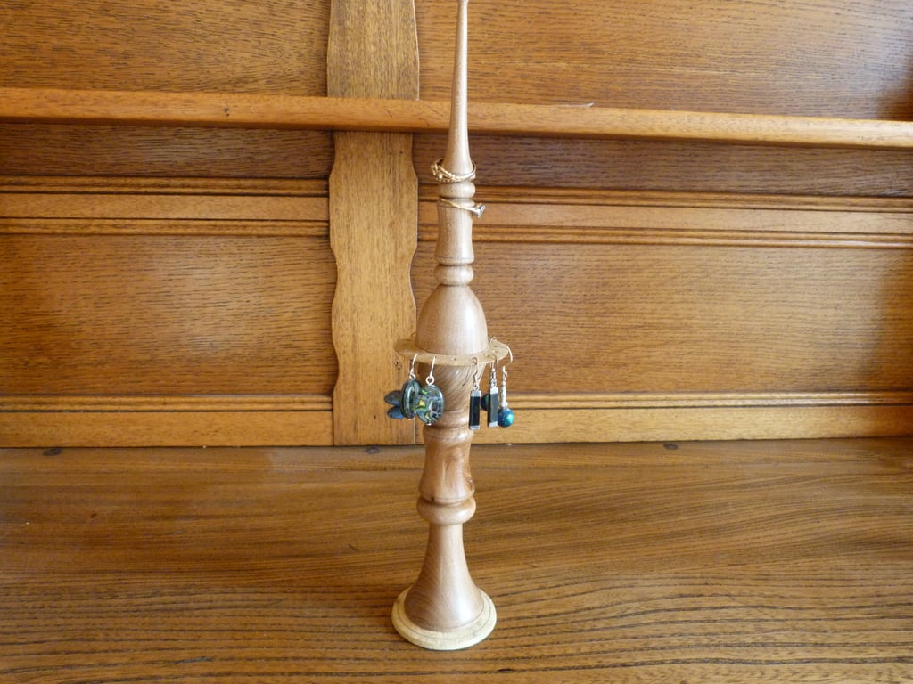 A finialed ring box and earring stand.