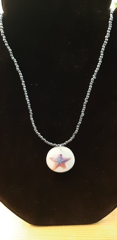 Tattoo Starfish Resin Pendant on a Beaded Necklace