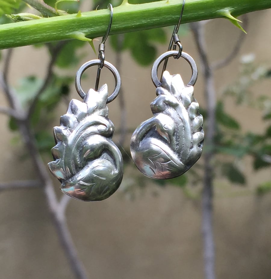Silver preening bird earrings