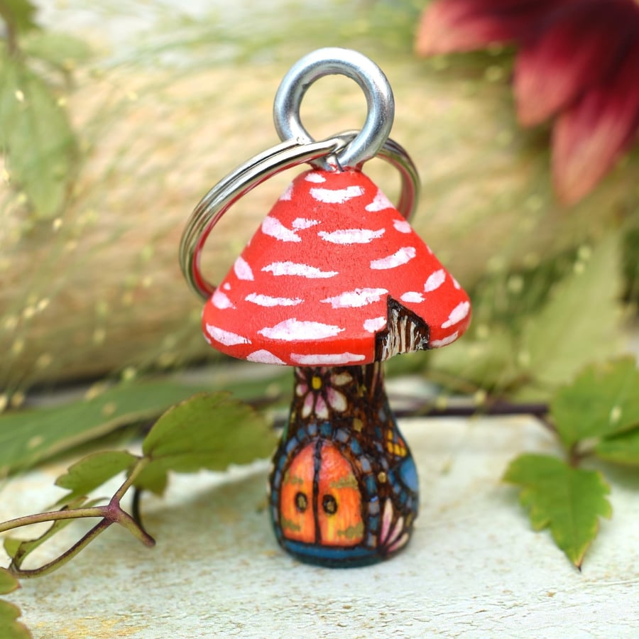 Small red mushroom fairy house keyring hand burned using pyrography.
