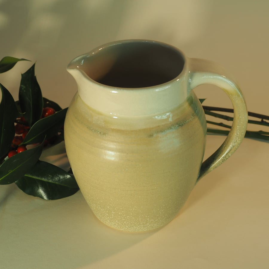 Wheel thrown ceramic jug, traditional shape, light green