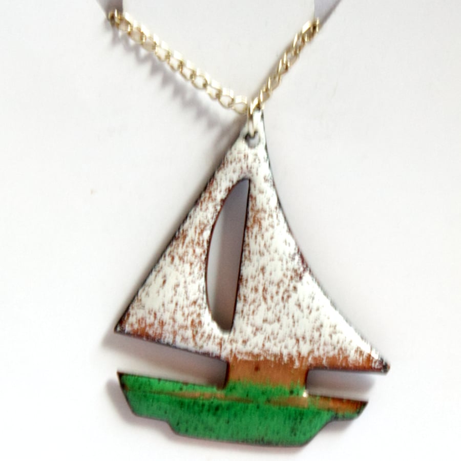 boat with green hull and white sails - pendant