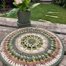 Crochet Plant Mat in calming forest shades