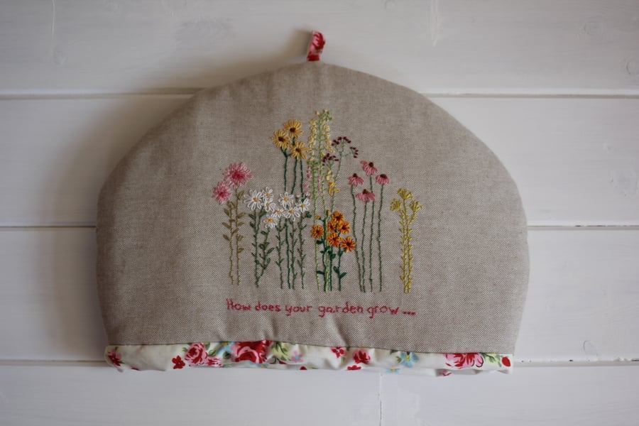 Hand embroidered floral tea cosy with cream floral lining