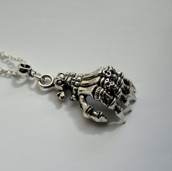 Long skeleton hand necklace