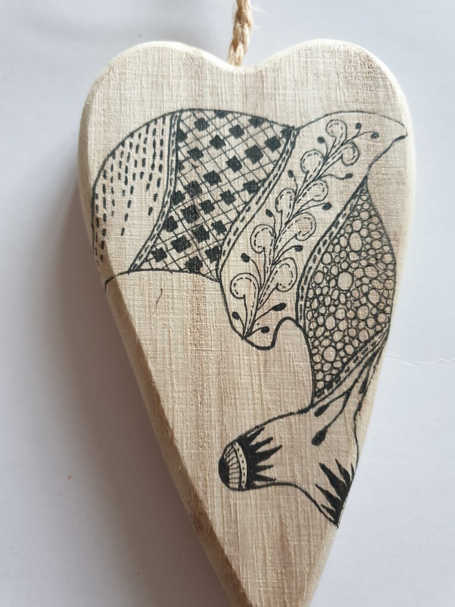 Dolphin hand drawn wooden heart