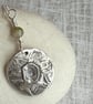 Sterling silver botanical pendant with daffodil and tourmaline. - Image 1