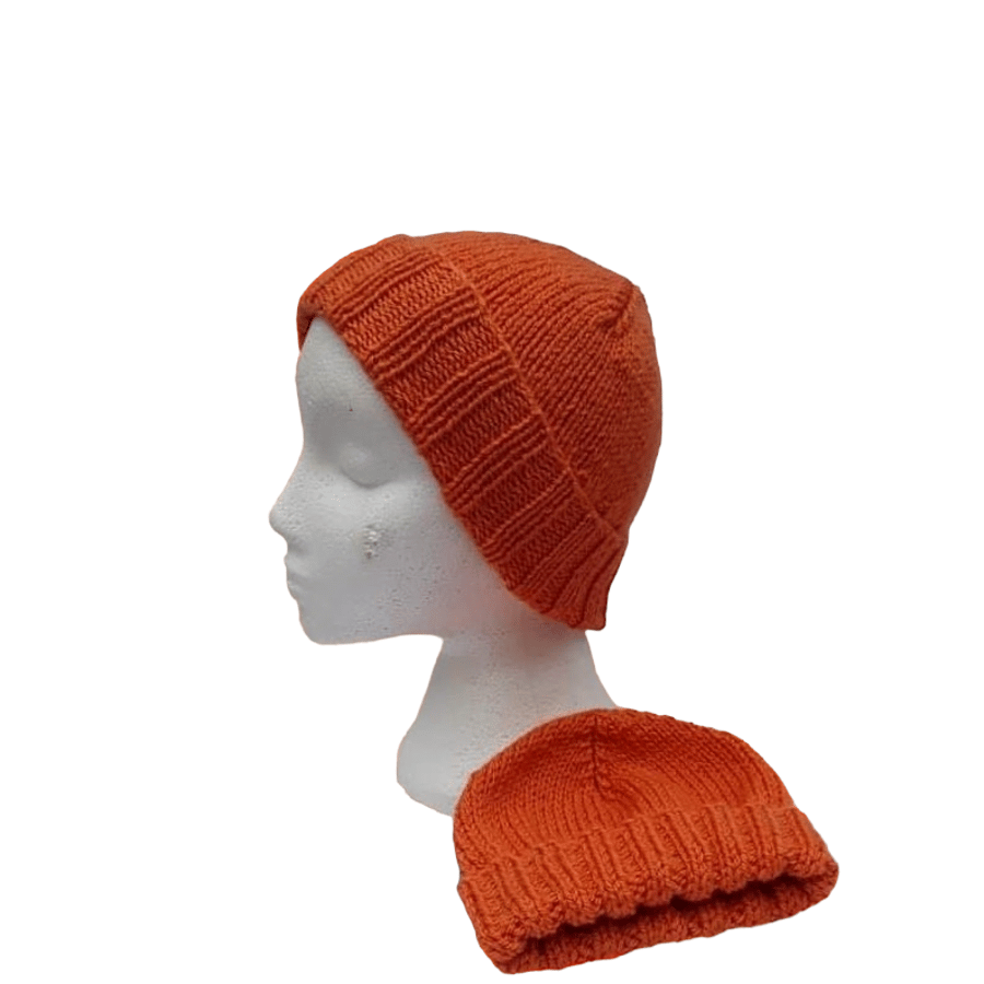 Hand knitted children's girls or boys spiced orange winter hat